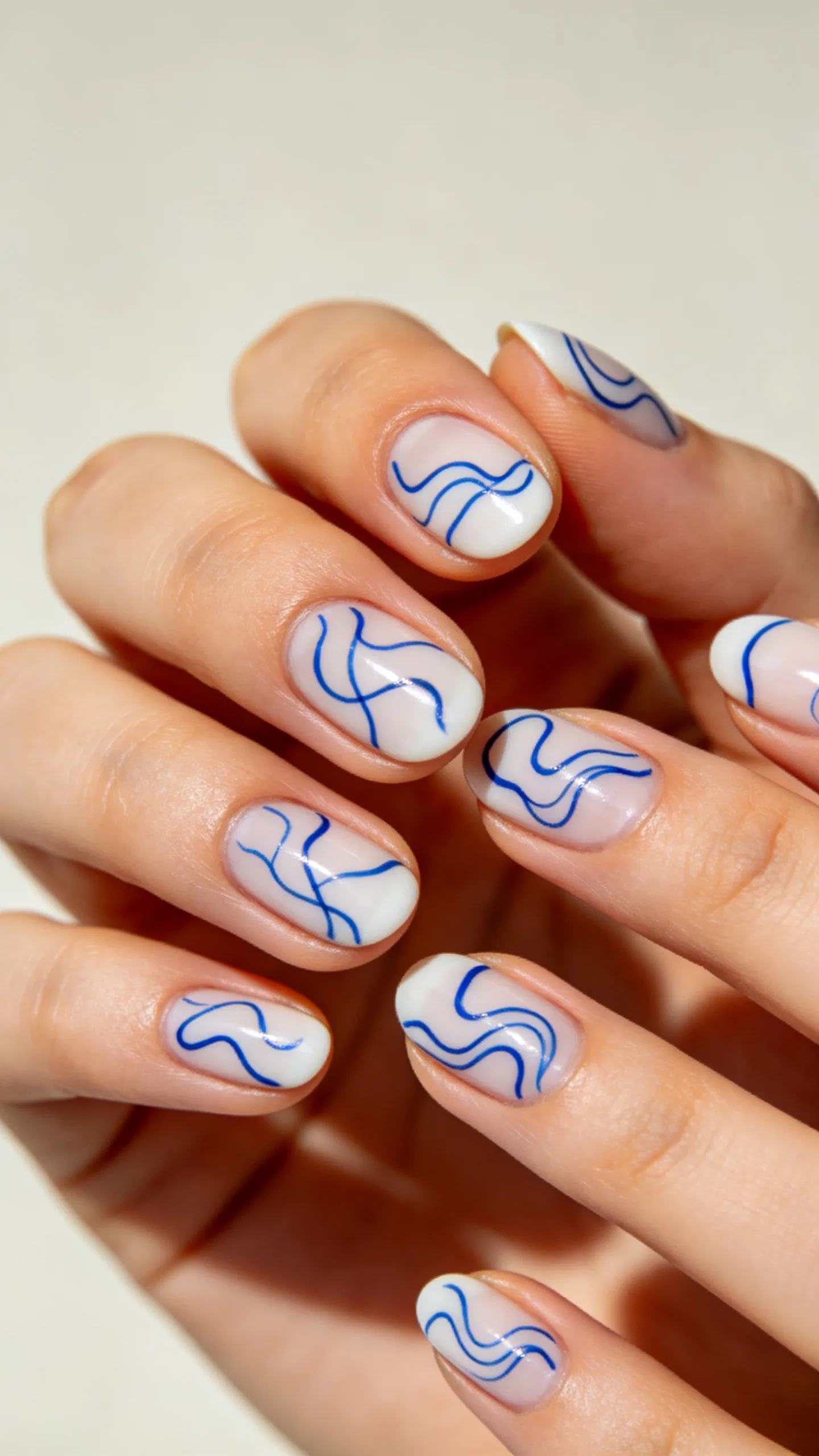13. Abstract Blue Squiggles on Oval Nails